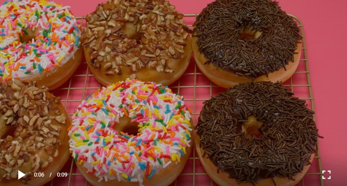 Donuts with various types of icing in a close up shot